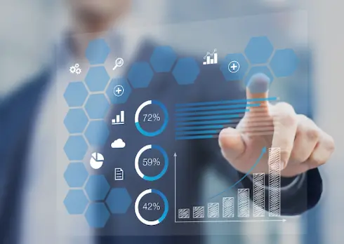 Person pointing at charts and graphs